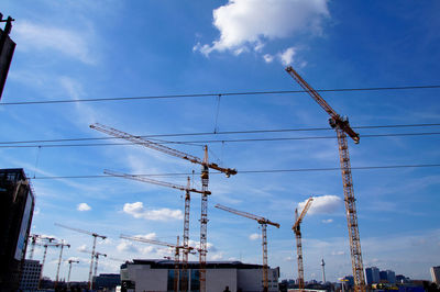Low angle view of electricity pylon against sky