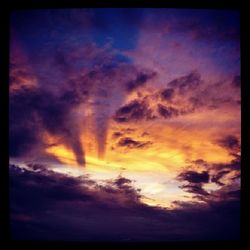 Scenic view of dramatic sky at sunset