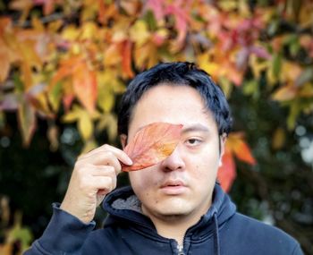 Portrait of man holding ice cream