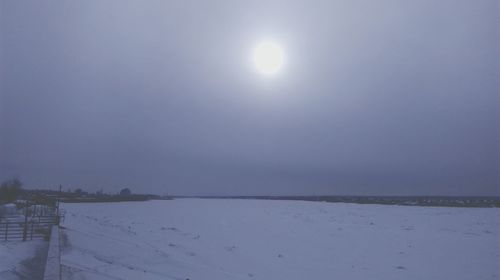 Scenic view of sea against sky during winter