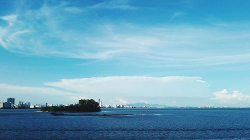 Scenic view of sea against blue sky