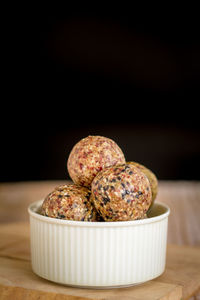 Close-up of food on table against black background