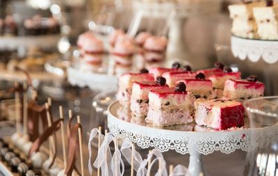 Close-up of cakes slices on stand