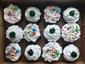 Directly above shot of cupcakes on table