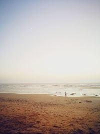 Scenic view of beach against clear sky