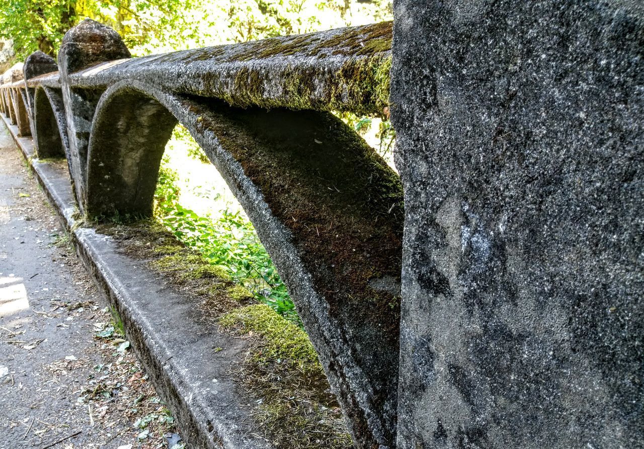 CLOSE-UP OF BRIDGE OVER STONE WALL