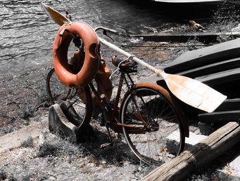 High angle view of abandoned bicycle by water