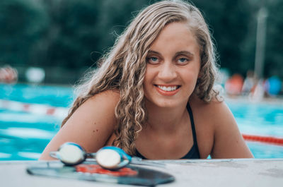 Portrait of smiling woman in swimming pool