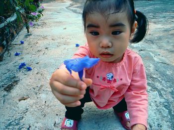 Portrait of cute girl holding ice cream