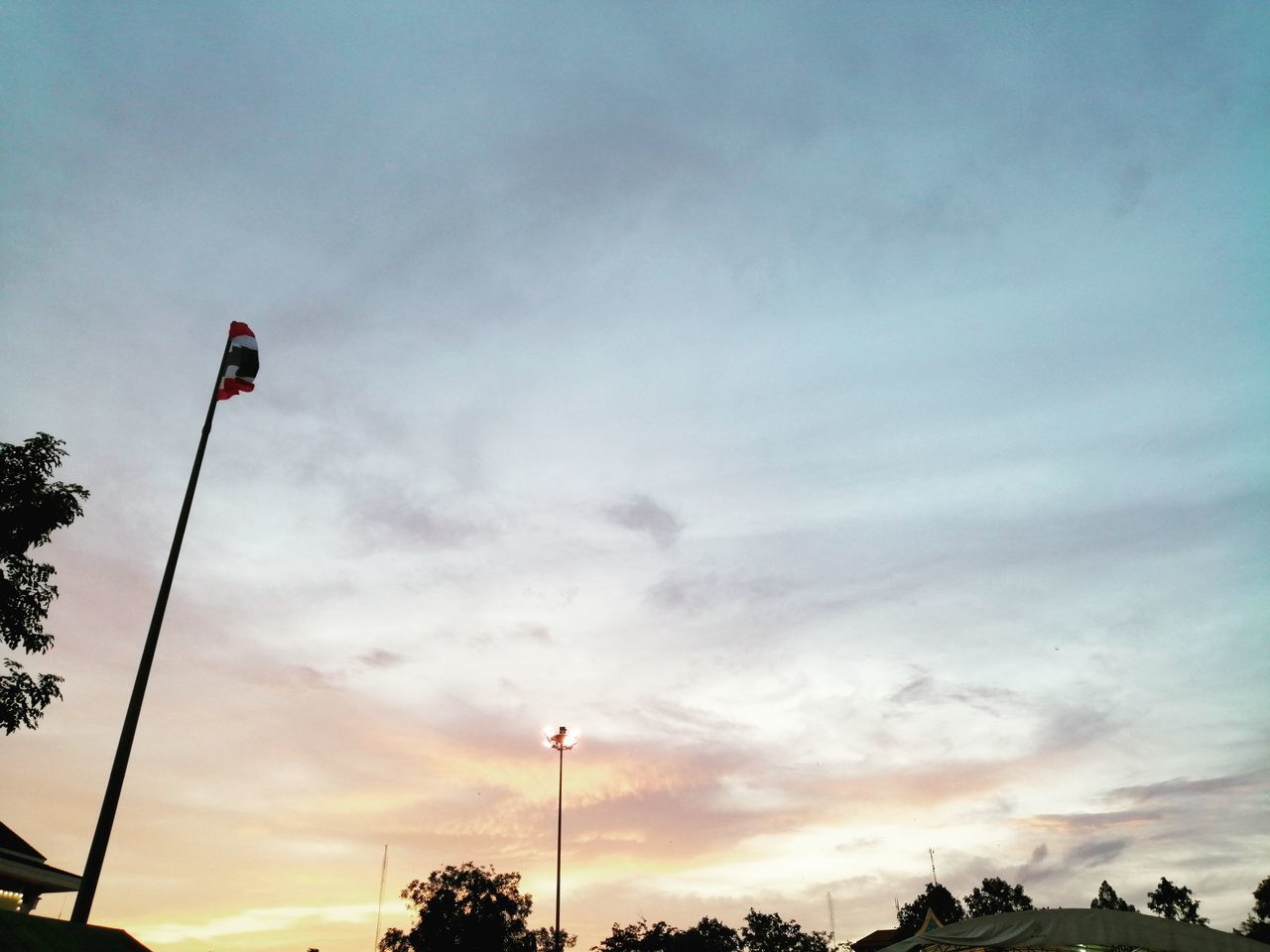 LOW ANGLE VIEW OF STREET LIGHTS AGAINST SKY