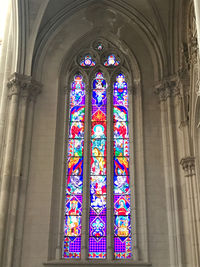 Low angle view of stained glass window in building