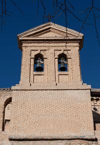 Low angle view of building against blue sky