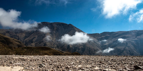 Scenic view of volcanic mountain range against sky