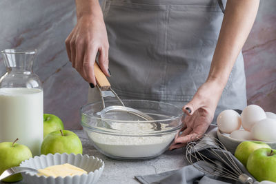 Midsection of man preparing food on table