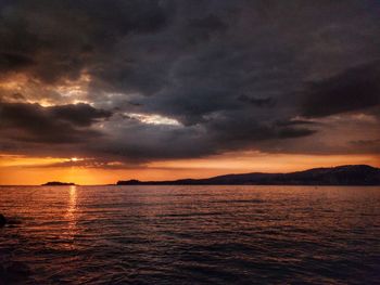 Scenic view of sea against dramatic sky