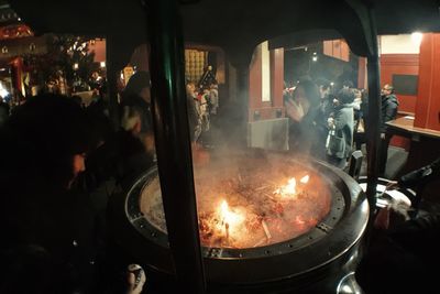 Man working on display at night