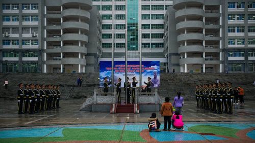 People in front of office building