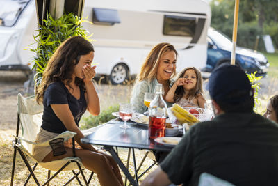 Family having meal at camping