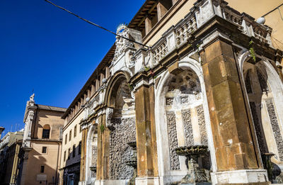 Low angle view of ornate building against sky