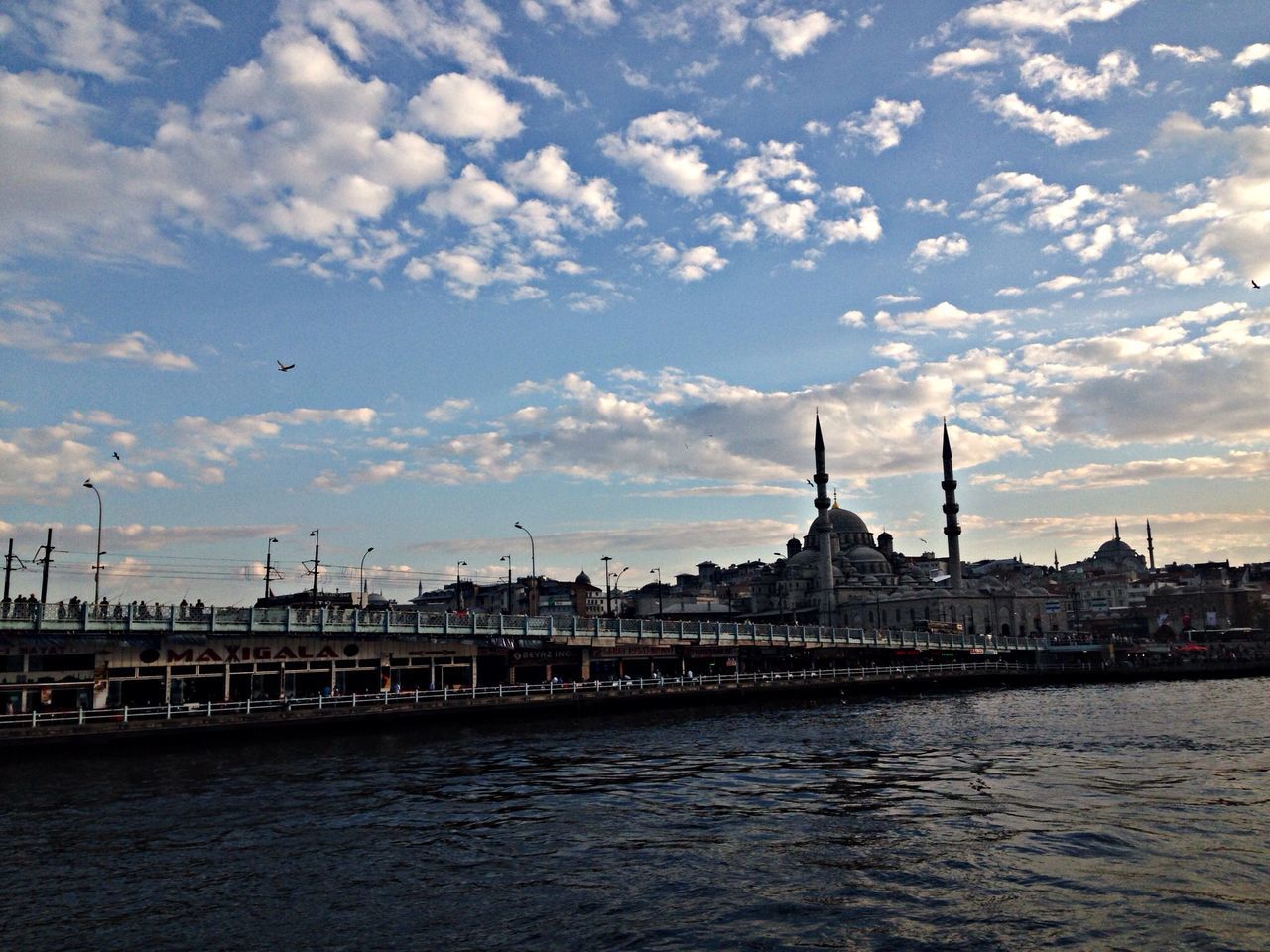 architecture, built structure, building exterior, water, waterfront, sky, river, cloud - sky, city, travel destinations, famous place, travel, sunset, international landmark, cloud, tourism, rippled, capital cities, cloudy, outdoors