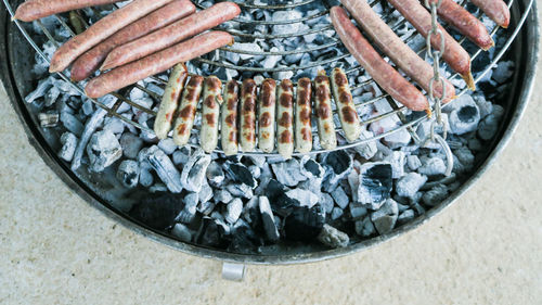 High angle view of meat on barbecue grill