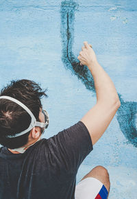 High angle view of man wearing sunglasses at swimming pool