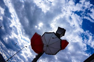 Low angle view of umbrella against sky