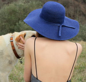Rear view of woman with dog