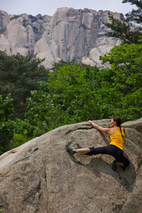 Female climber bouldering at seroksan national park in south korea