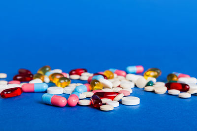 Close-up of pills on blue background