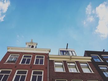 Low angle view of building against blue sky