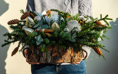 Christmas composition decorated with spices, cones and cotton