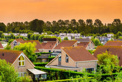 High angle view of houses and buildings against sky