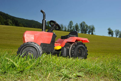 Tractor on field against sky