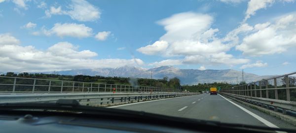 Road seen through car windshield