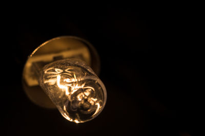 Close-up of glass over black background