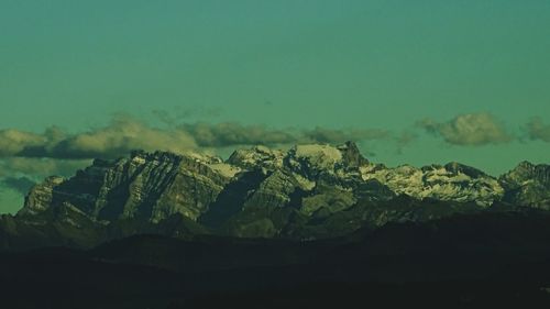 Scenic view of green landscape against sky