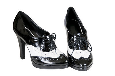 Close-up of shoes against white background