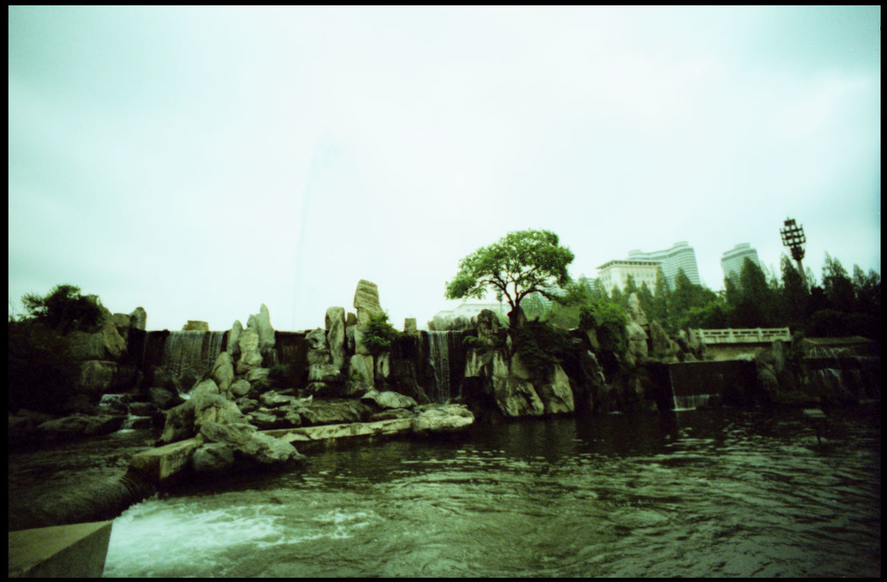 PANORAMIC SHOT OF BUILT STRUCTURES AGAINST CLEAR SKY