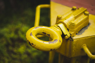 High angle view of yellow machine part