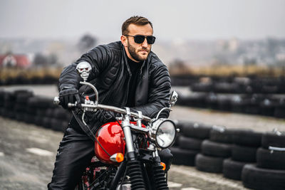 Portrait of young man riding motorcycle