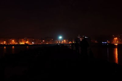 Illuminated cityscape at night