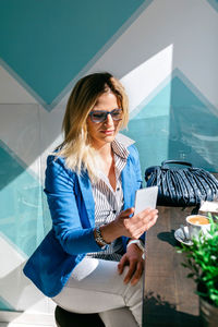 Young woman using mobile phone