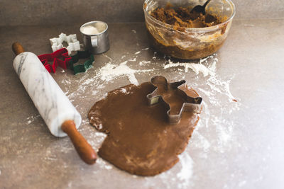 Rolled out gingerbread cookie dough with cookie cutters