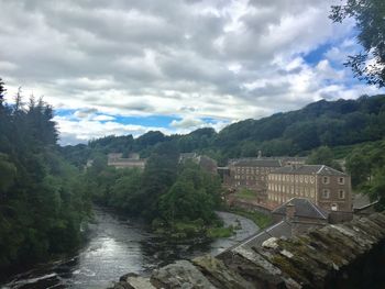 Scenic view of waterfall against sky