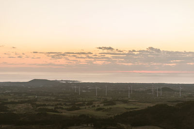 Scenic view of landscape against sky during sunset