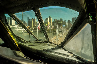 Aerial view of city seen through glass window