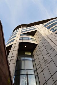 Low angle view of modern building against sky