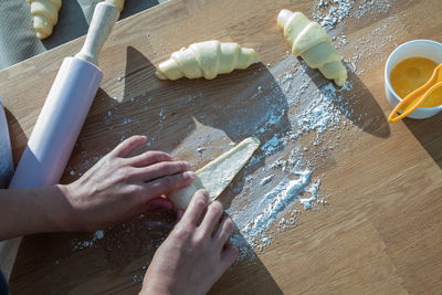 High angle view of person preparing food on table