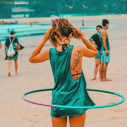 Friends standing at beach